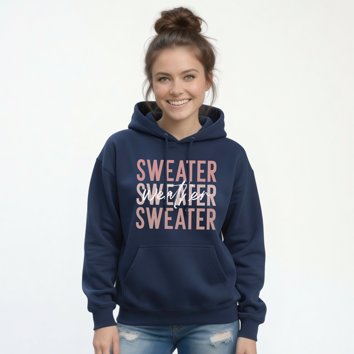 Woman wearing navy Sweater Weather hoodie with jeans