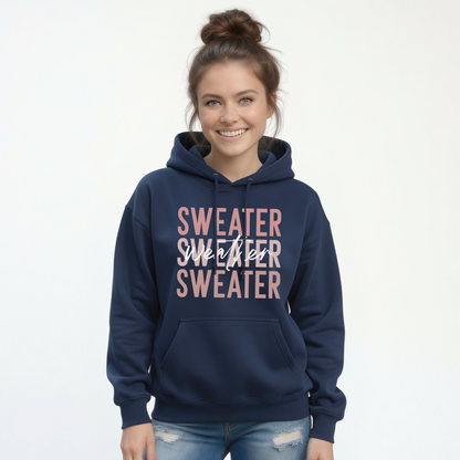 Woman wearing navy Sweater Weather hoodie with jeans