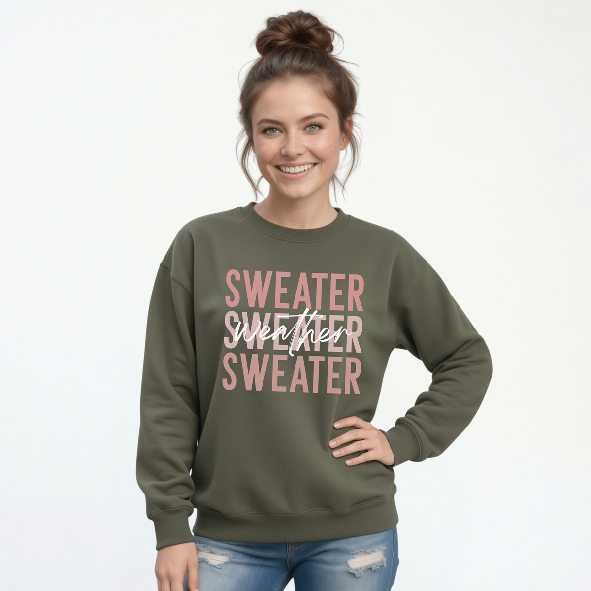 Woman wearing military green Sweater Weather crewneck sweatshirt with jeans