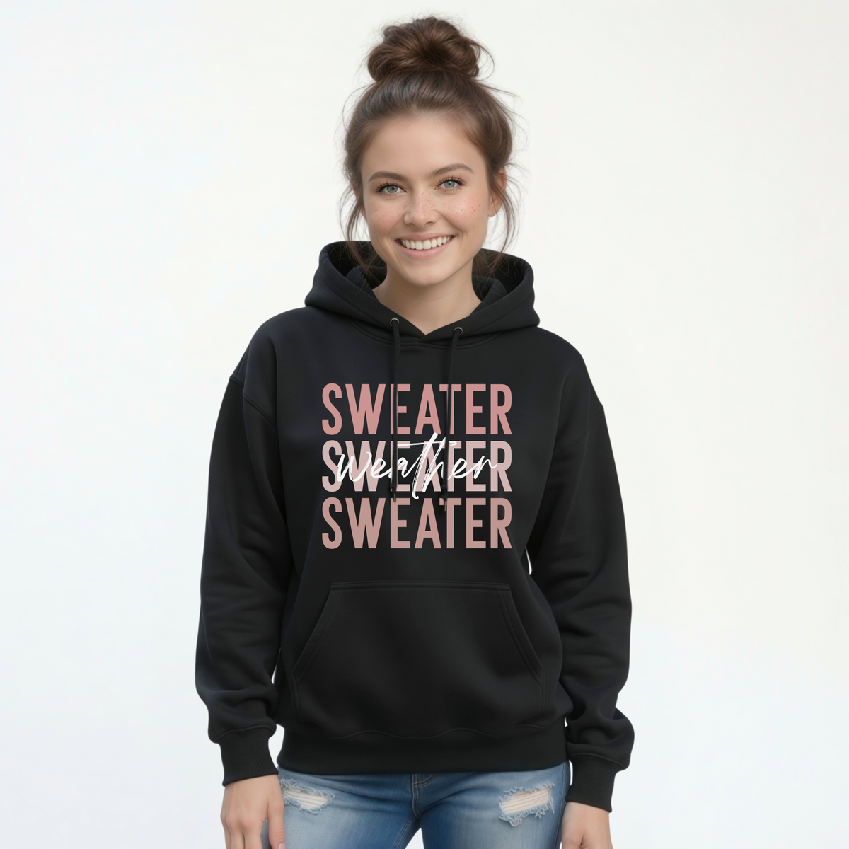 Woman wearing black Sweater Weather hoodie with jeans