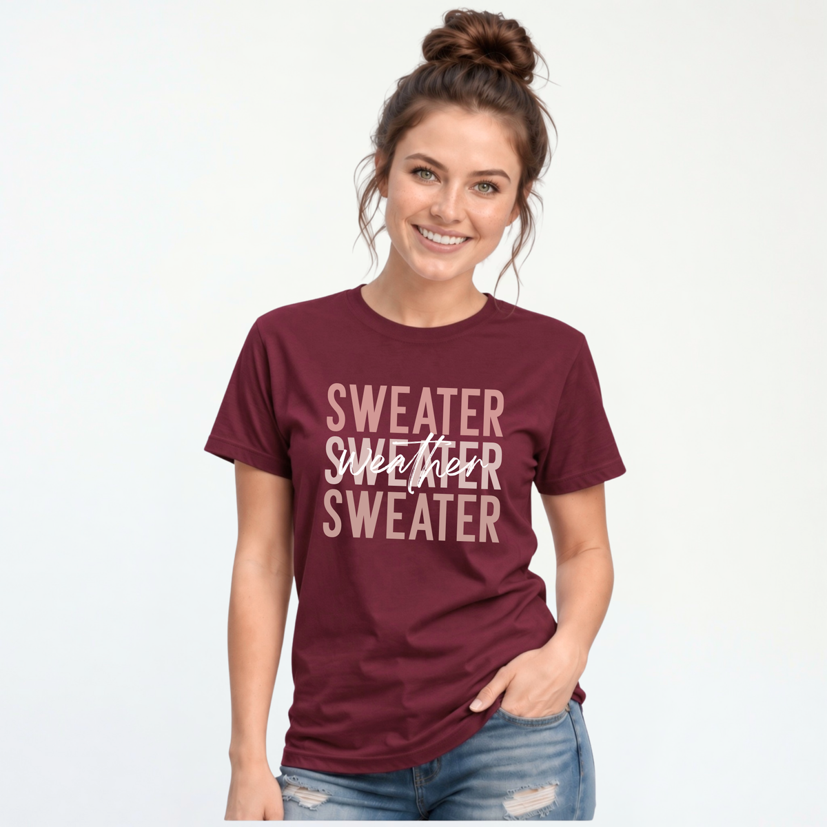 Woman wearing maroon Sweater Weather T-shirt with jeans