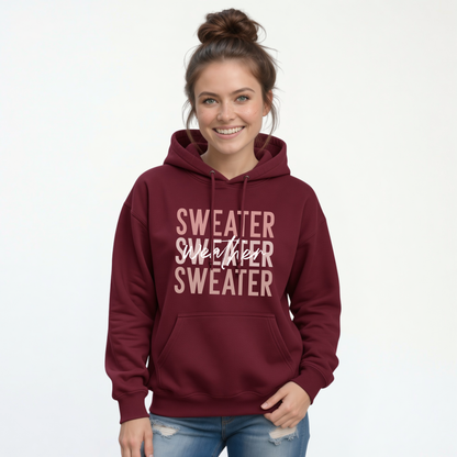 Woman wearing maroon Sweater Weather hoodie with jeans
