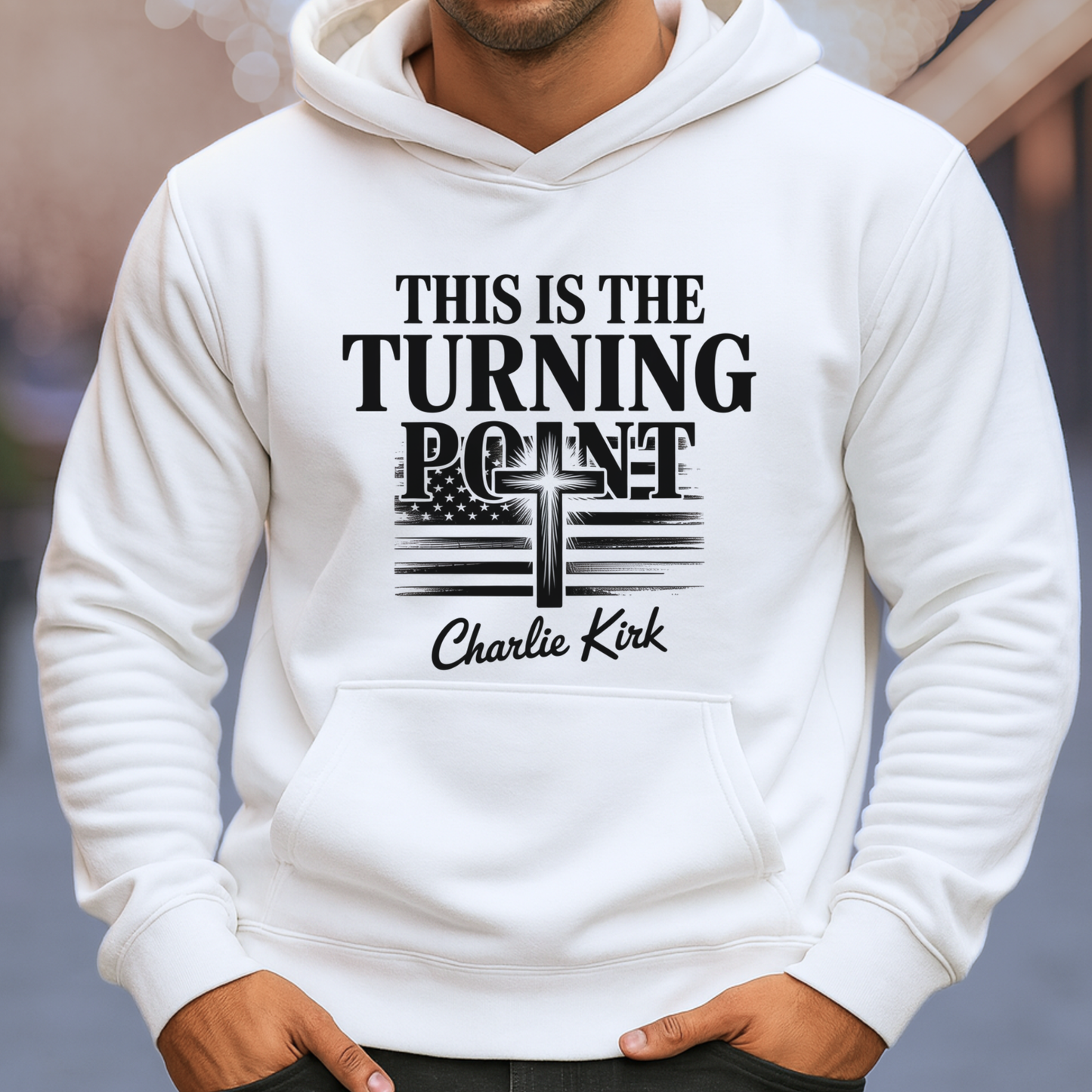 Man wearing white hoodie with “This Is the Turning Point” cross and American flag graphic