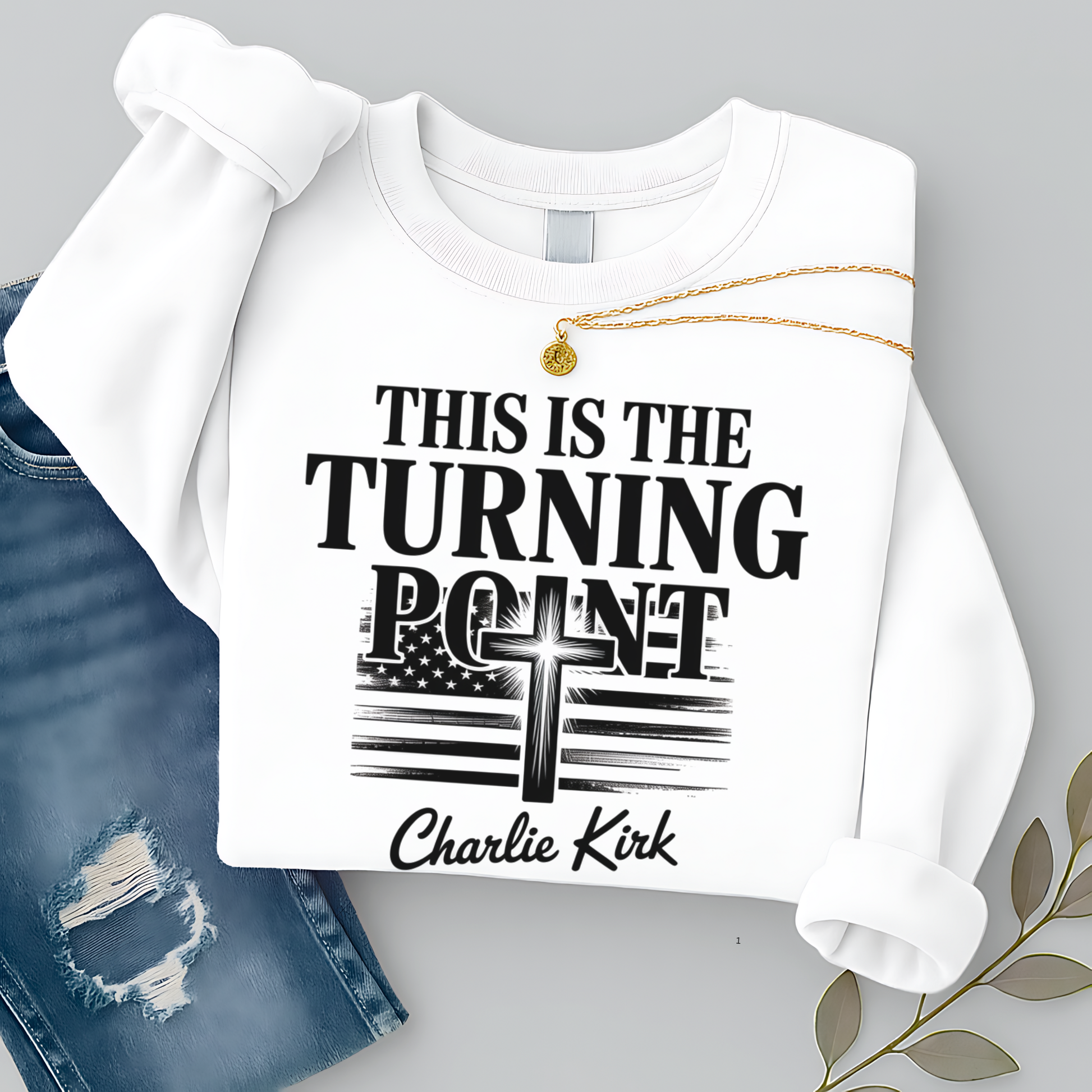 Flat lay white sweatshirt displaying “This Is the Turning Point” cross and American flag graphic