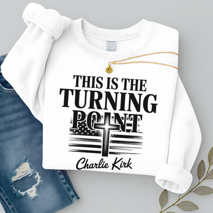 Flat lay white sweatshirt displaying “This Is the Turning Point” cross and American flag graphic