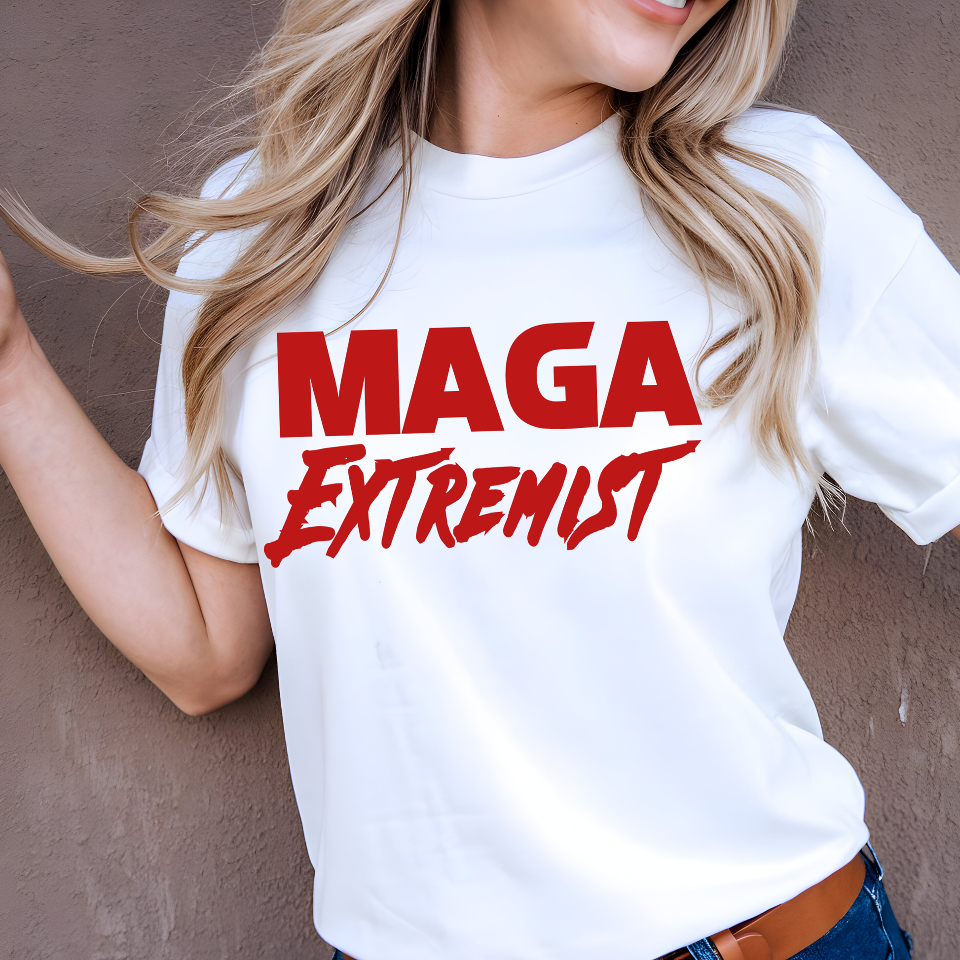 Woman  wearing white T-shirt with bold red statement text graphic, tied hem style.