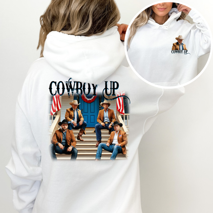 White hoodie with 'Cowboy Up' design featuring four men on steps, surrounded by American flags.
