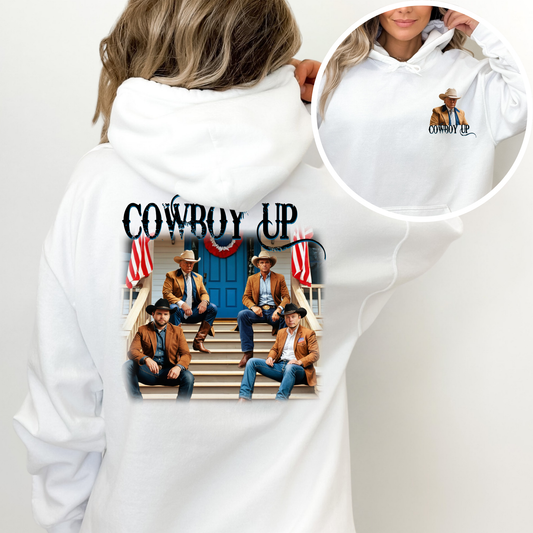 White hoodie with 'Cowboy Up' design featuring four men on steps, surrounded by American flags.
