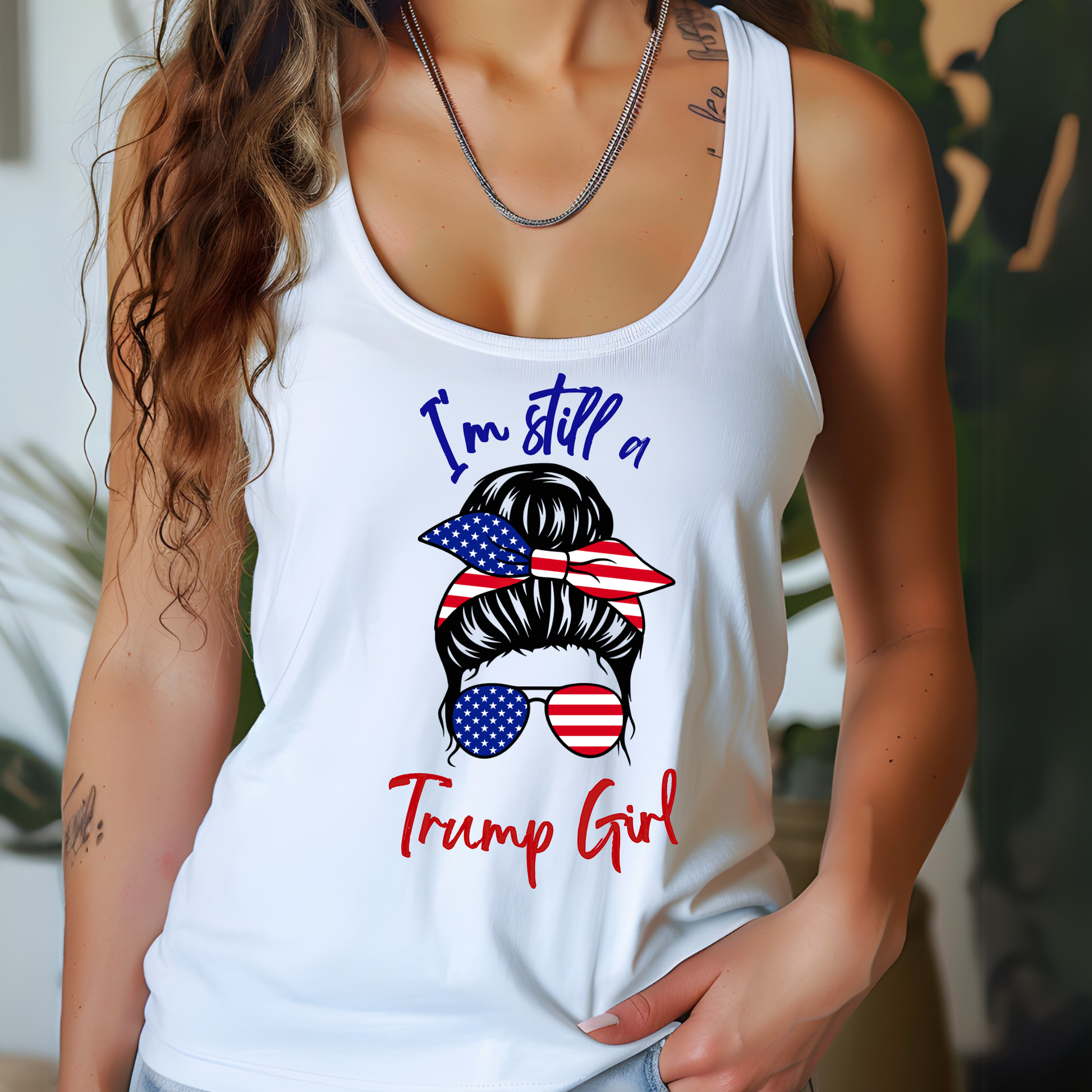 Woman wearing White racerback tank with patriotic bun and sunglasses graphic
