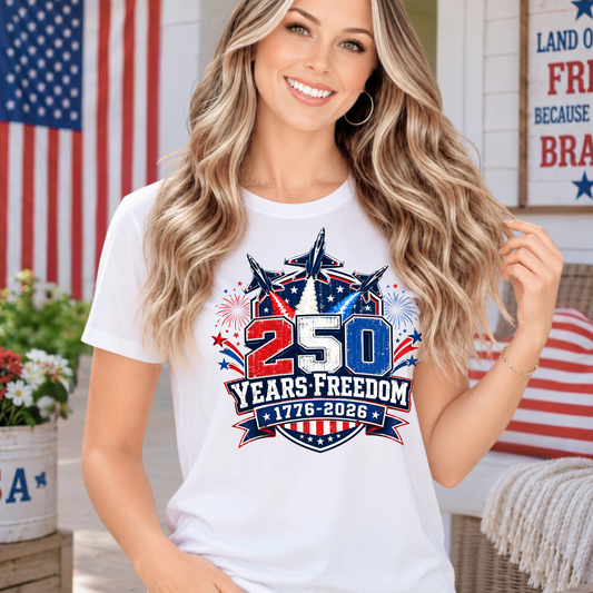 Woman wearing a white t-shirt with a 250 Years Freedom design in front of an American flag.