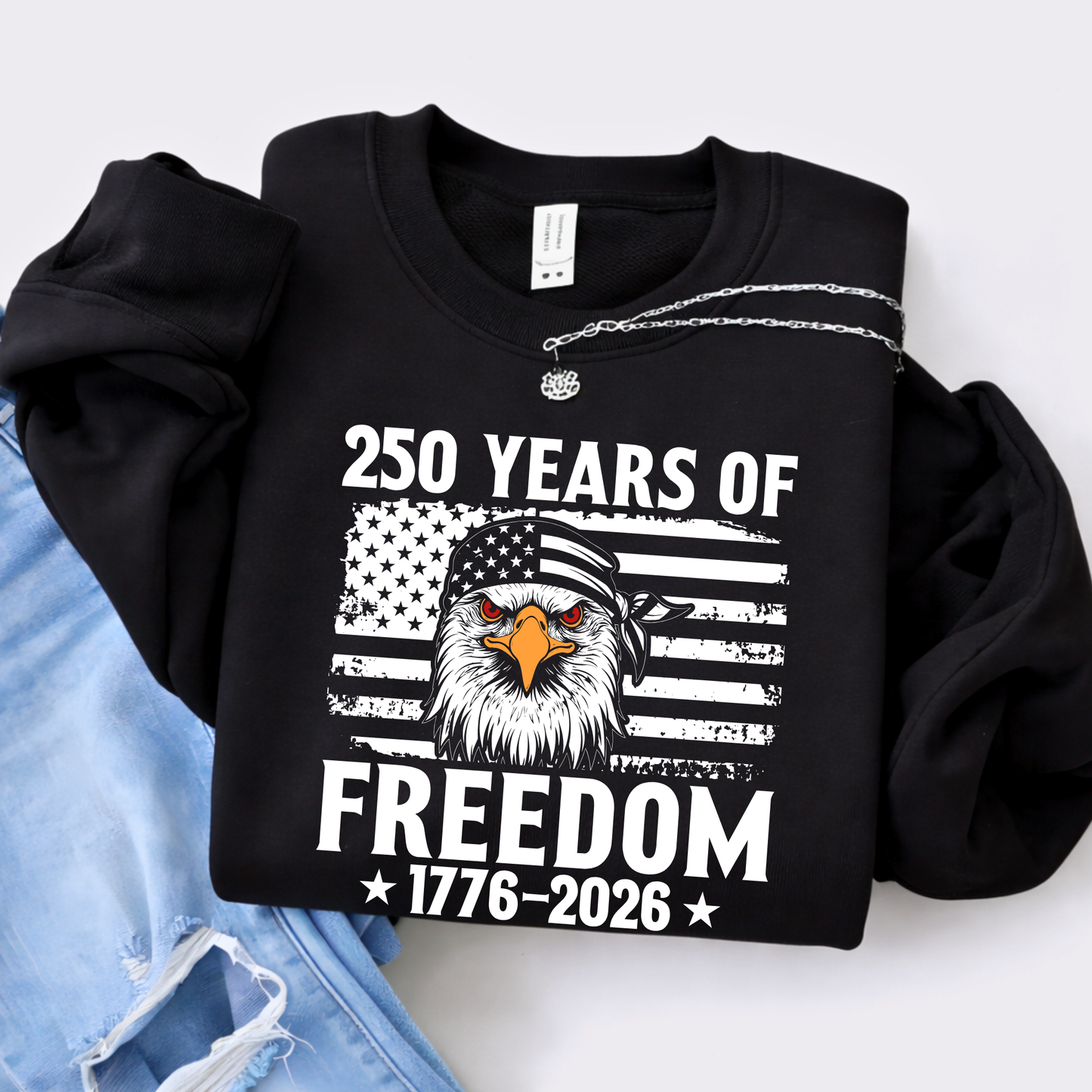 Black sweatshirt with eagle and American flag design celebrating 250 years of freedom, displayed on a white background.